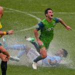 Sounders midfielder Nicolas Lodeiro (10) is tripped up by New York City FC defender Rodney Wallace (23) during the first half of an MLS match on June 17, 2017, in New York. (AP Photo/Julie Jacobson)