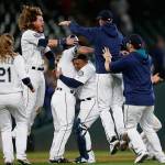 The Mariners&rsquo; Kyle Seager (center) is mobbed by teammates after hitting a walk-off double in the 10th inning of a game against the Tigers on June 20, 2017, in Seattle. (AP Photo/Lindsey Wasson)