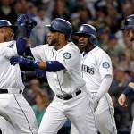 The Mariners&rsquo; Robinson Cano (second from left) is congratulated by Jean Segura (2), Mitch Haniger (right) and Guillermo Heredia after hitting a grand slam against the Tigers in the seventh inning June 22, 2017, in Seattle. (AP Photo/Elaine Thompson)