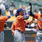 The Astros&rsquo; Jake Marisnick (right) is congratulated by Josh Reddick (22) and Yuli Gurriel after hitting a three-run home run against the Athletics in the first inning of a game June 22, 2017, in Oakland, Calif. (AP Photo/Ben Margot)