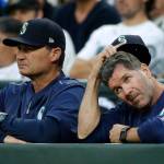 Mariners manager Scott Servais (left) and hitting coach Edgar Martinez watch from the dugout during the fifth inning of a game against the Phillies on June 27, 2017, in Seattle. (AP Photo/Ted S. Warren)