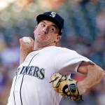 Mariners starting pitcher Andrew Moore throws to the Tigers during the fourth inning of a game June 22, 2017, in Seattle. (AP Photo/Elaine Thompson)