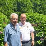 Dale Reiner, a local farmer, visits with Mike Dickinson, a fire battalion chief in Monroe. The two men are related, and Dickinson was called to Reiner&rsquo;s home in April when Reiner suffered a heart attack. (Rikki King / The Herald)
