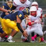 Bubba Isaia of Mariner recovers a fumble during a 2014 game against Snohomish in his sophomore season. (Annie Mulligan / The Herald, file)