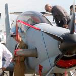Visitors looks into a Diamond DART 450, a two-seat civilian and military turboprop trainer built by Austrian Diamond Aircraft, at the Paris Air Show in Le Bourget, east of Paris, France, on Tuesday, June 20. (AP Photo/Michel Euler)