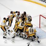 Pittsburgh Penguins players celebrate after defeating the Nashville Predators 2-0 in Game 6 of the Stanley Cup Final on Sunday in Nashville. (AP Photo/Jeff Roberson)