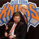 Phil Jackson puts his hand on New York Knicks owner James Dolan during a news conference in March of 2014 where Jackson was introduced as team president. (AP Photo/Richard Drew, File)