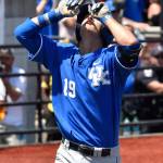 Kentucky&rsquo;s Evan White points skyward as he crosses home plate after hitting a solo home run in the ninth inning during Friday in an NCAA Super Regional game against Louisville. (AP Photo / Timothy D. Easley)