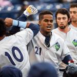 Hillsboro&rsquo;s Domingo Leyba (21) celebrates his three-run home run in the fifth inning of Monday&rsquo;s game in Everett. (Kevin Clark / The Herald)