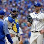 Seattle Mariners starting pitcher James Paxton, right, and catcher Mike Zunino, center, wait to talk with pitching coach Mel Stottlemyre, left, after Paxton gave up the second of two runs to the Toronto Blue Jays in the fourth inning of a baseball game Sunday, June 11, 2017, in Seattle. (AP Photo/Elaine Thompson)