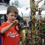 Brody Moen, 7, of Shoreline, checks out a water garden sculpture by Vancouver B.C. artist Douglas Walker during the 2012 Edmonds Arts Festival at the Frances Anderson Center. (For the Herald/Doug Ramsay)