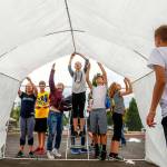 Sixth-graders at Haller Middle School in Arlington have nearly completed construction of a Mars habitat on the school tennis courts Monday. (Dan Bates / The Herald)