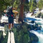 In this June 16 photo, Jake Gustafson crosses Bear Creek along the Pacific Crest Trail near Kings Canyon National Park, California. (Wesley Tils via AP)