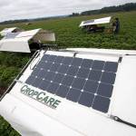 Solar panels power the picking assistants at Biringer Farms on Monday in Arlington. The individual units let pickers move at their own pace. (Andy Bronson / The Herald)