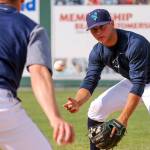 Joe Venturino, right, fields a thrown ground ball by hitting coach Austin Knight, left, during the Aquasox&rsquo;s first day of training at Everett Memorial Stadium in Everett on June 11, 2017. (Kevin Clark / The Herald)