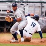 Hillsboro&rsquo;s Eudy Ramos tags out Everett&rsquo;s Juan Camacho at third base Thursday at Everett Memorial Stadium in Everett. (Kevin Clark / The Herald)