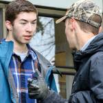 Hunter Thompson talks with Aaron Eastman during a work party May 13 at Sherwood Community Center. (Kevin Clark / The Herald)
