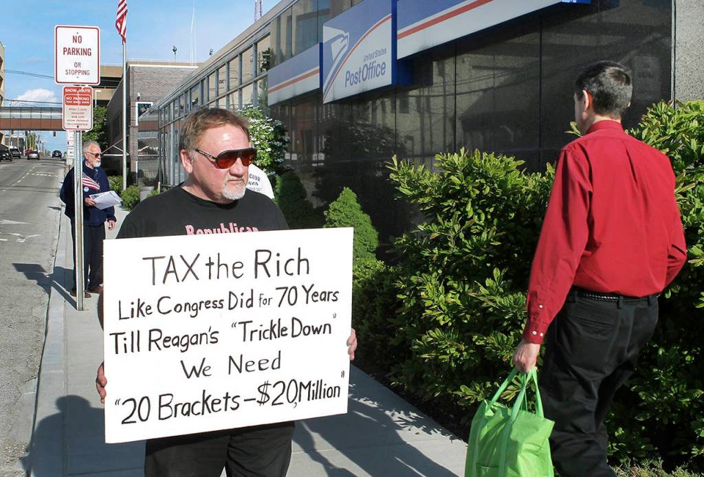 In this April 17, 2012 photo, James Hodgkinson of Belleville protests outside of the United States Post Office in Downtown Belleville, Illinois. (Derik Holtmann/Belleville News-Democrat, via AP)