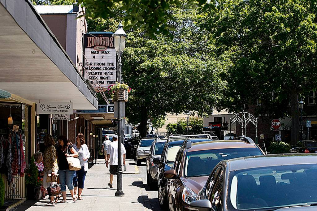 Edmonds Theater is visible along Main Street in downtown Edmonds. From the roundabout that serves as the hub of downtown Edmonds, Main Street continues west to the ferry dock, which offers a 30-minute trip to nearby Kingston. (Ian Terry / The Herald)