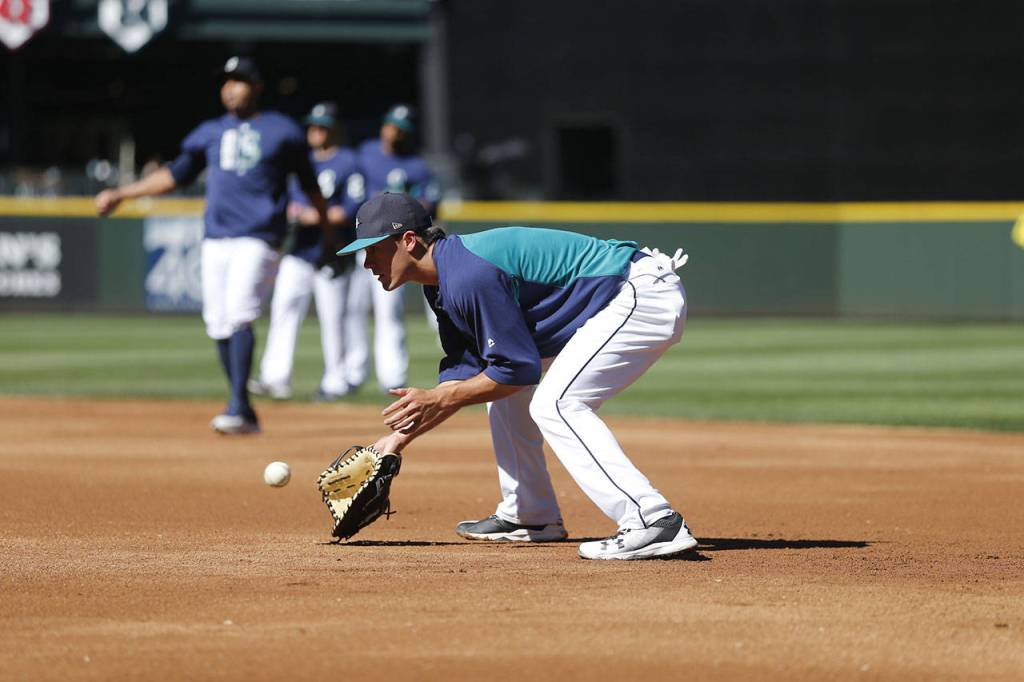 Mariners top draft pick Evan White takes ground balls at first base during batting practice at Safeco Field on June 23, 2017, in Seattle. (Ben VanHouten/Seattle Mariners).