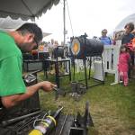 Glass blowing artist Chris Schuelke, of Edmonds, works on making a glass goblet during a demonstration at the 2012 Edmonds Arts Festival at the Frances Anderson Center. (For the Herald/Doug Ramsay)