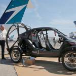 Visitors look at the flying car Pegasus 1, built by French entrepreneur Jerome Dauffy, at the Paris Air Show in Le Bourget on Tuesday, June 20. (AP Photo/Michel Euler)