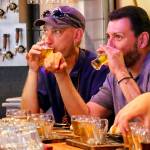 Kevin Westlund (left) and Jose Gonzalez try samples at Old Man Brewing. (Kevin Clark / The Herald)