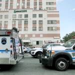 Police vehicles converge on Bronx Lebanon Hospital in New York after a gunman opened fire there on Friday. The gunman, identified as Dr. Henry Bello who used to work at the hospital, apparently took his own life after shooting others, authorities said. (AP Photo/Mary Altaffer)