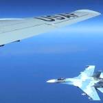 A Russian jet comes within a few feet of a U.S. Air Force reconnaissance jet over the Baltic Sea on June 19. ( Master Sgt Charles Larkin Snr/U.S. European Command via AP)