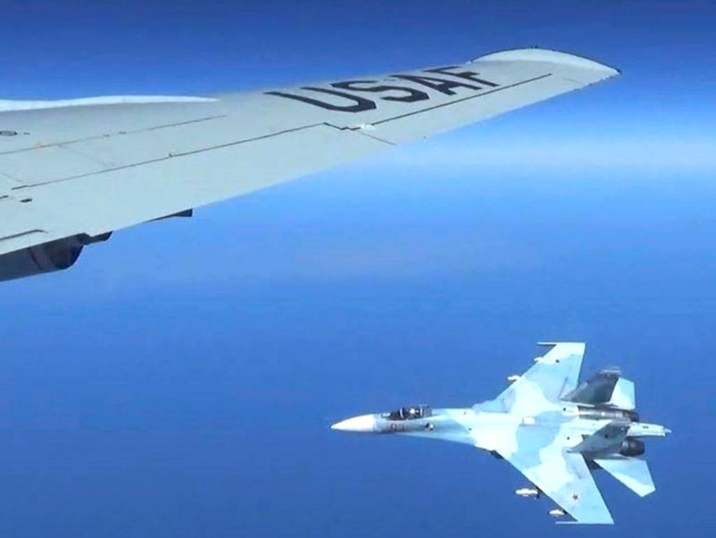 A Russian jet comes within a few feet of a U.S. Air Force reconnaissance jet over the Baltic Sea on June 19. ( Master Sgt Charles Larkin Snr/U.S. European Command via AP)