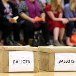 Ballot boxes await the vote but were not used because the vocal vote to authorize a strike was unanimous. (Kevin Clark / The Herald)