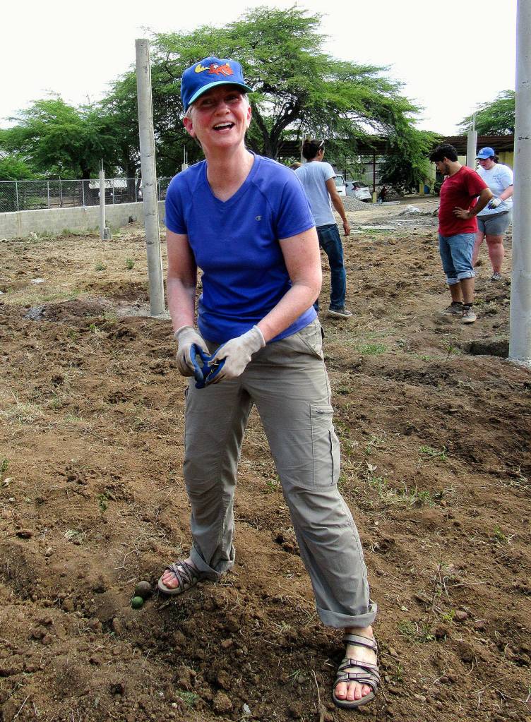 Snohomish County Superior Court Judge Janice Ellis works in a garden at Dajabon in the Dominican Republic as part of a Rotary Club of Everett trip in April. Ellis was injured during a visit to a waterfalls attraction during the trip. (Everett Police Capt. Greg Lineberry photos)