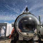 Before dive at the Port of Everett Marina recently, Josh Dean looks out the front dome of the OceanGate sub Cyclops I. OceanGate plans to carry paying customers on dives to the Titanic in 2018. (Andy Bronson / The Herald)