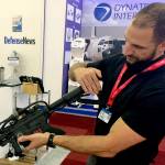 David Romero, of the Boise, Idaho-based firm Black Sage, showcases a drone-zapping gun that is part of an anti-drone system his firm is displaying at the Paris Air Show on Tuesday, June 20, in Le Bourget. The proliferation of unmanned aircraft is increasing concerns that terrorists could use drones to attack crowds at sports stadiums and other events. (AP Photo/John Leicester)