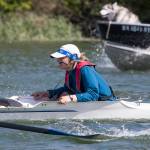 Everett Rowing Association coxswain Summer Keyes calls out timing, steers the boat and talks to her crew as they practice on the Snohomish River on June 5 in Everett. (Andy Bronson / The Herald)