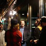 Ryan Crowther (center) talks with friends and musicians at an Everett Music Initiative event in 2014. (Mark Mulligan / Herald file)
