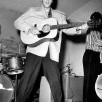 Elvis Presley plays guitar during a concert in Fort Worth, Texas, early in his career. (File Photo/Fort Worth Star-Telegram)