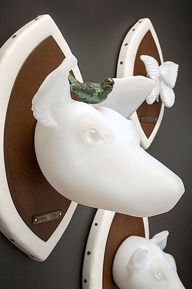 &ldquo;Critical Masse&rdquo; involves glass &ldquo;ghost animals&rdquo; - such as this African wild dog - that are part of O&rsquo;Dell&rsquo;s focus on endangered species. The little bird is reminiscent of the oxpecker birds that sit on rhinos in the wild and warn the beasts about predators.