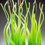 &ldquo;Cattails,&rdquo; a blown glass piece by Katie Matson, is displayed in the current Art of the Garden exhibition at the Schack Art Center in Everett.