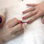 The author applies the first of two coats of gel polish to her sister&rsquo;s nails. (Vanessa McVay / The Herald)