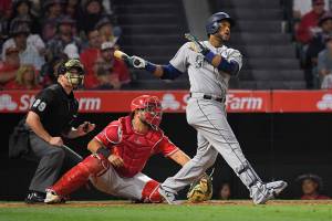 Cano homers twice, Miranda pitches M’s past Angels 10-0