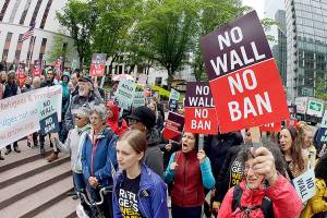 Trump travel ban partly reinstated; fall court arguments set