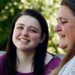 Recent AIM High School graduate Dakota Mowry, 18, talks with her mom, Crystal Scholl, at the family home in Snohomish Wednesday. Scholl was pregnant when she started at AIM, and baby Dakota, born in 1999, was cared for at the school&rsquo;s child-care center. Scholl graduated from AIM in 2000. (Dan Bates / The Herald)