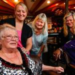 Sue Brauch, (left) a bartender for more than 50 years, is joined and celebrated by friends and colleagues Monday at Patty&rsquo;s Eggnest, the longtime Chuckwagon Inn, on Evergreen. Behind Brauch at left is new bartender Tricia Flood, her mother and customer Linda Flood, restaurant manager Pam Gahan, and loyal customer Dwight Jeffries. Brauch, 76, is retiring this week after 13 years behind the bar at the Everett lounge and restaurant. (Dan Bates / The Herald)