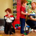 In their basement playroom Thursday morning, Alex Clawson, 32, communicates firmly and thoughtfully with his eldest son, Willem, 4 while son Atley, 3 (left) plays with 20-month-old daughter Seirsha, who is wearing a Spider-Man cape. Clawson&rsquo;s wife and the children&rsquo;s mother, Amy Clawson, 33, as well as newborn daughter Elayda, died May 21 after Amy suffered heart failure. (Dan Bates / The Herald)