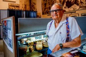 Ken Cage has good reason to be proud Friday as he and others prepare to open the new Marysville Historical Society&rsquo;s museum to the public. (Dan Bates / The Herald)