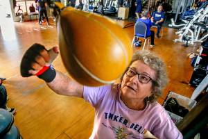 At Snohomish Fitness Center, Donna Thorp, of Lynnwood, briskly works out on a punching bag during a sponsored class for people with Parkinson&rsquo;s disease. Admitting she does pretty well with the boxing workout, Thorpe, 83, says, &ldquo;If I didn&rsquo;t have this Parkinson&rsquo;s, I&rsquo;d be fine.&rdquo; (Dan Bates / The Herald)