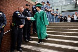 100 cops greet son of slain officer at Woodinville graduation