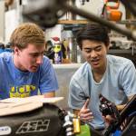 UCLA students Brent Kyono (right) and Luke Allee compare parts for UCLA Formula SAE team car in the Westwood campus workshop in Los Angeles, California, on May 3. (Brian van der Brug/Los Angeles Times)
