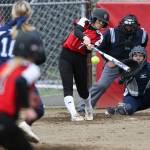 Snohomish&rsquo;s Bailey Greenlee (batting), and Meadowdale&rsquo;s Emma Helm (catching) and Lauren Dent (pitching) were first-team All-Wesco picks. (Andy Bronson / The Herald)